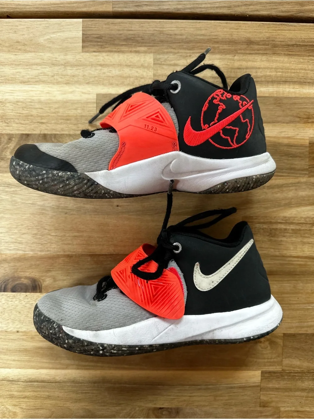 Nike Kyrie 4 sneakers in gray, black, and orange